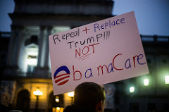 protest sign repeal and replace trump not obamacare