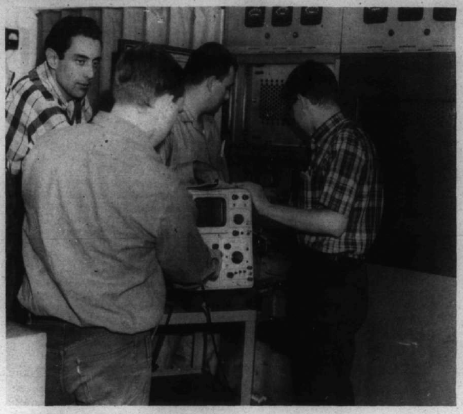 Students working of the old Channel 9 transmitter. From left, Jim Contantine, Jim Steendahl, Jerry Croslin, Ron Blassnig.—Photo by Alvin Thorknlonn.